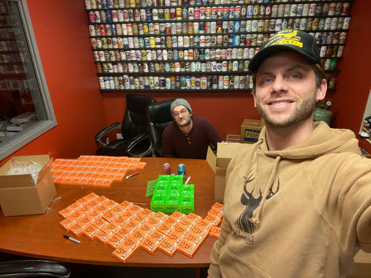 Charlie Berens and Dane Schaefer signing copies of Card Sale